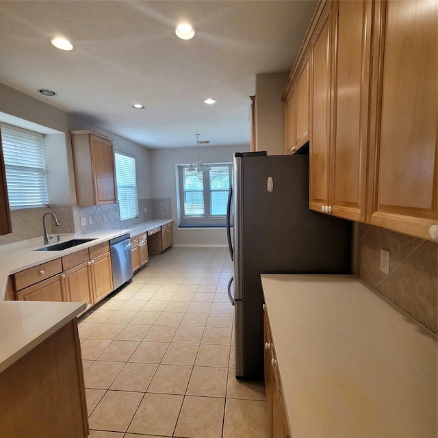 110 Greenridge Cir, League City, TX 77573 - kitchen featuring stainless steel dishwasher, tasteful backsplash, recessed lighting, light countertops, and light tile patterned flooring
