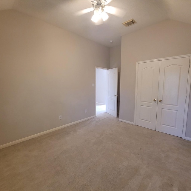 110 Greenridge Cir, League City, TX 77573 - unfurnished bedroom featuring lofted ceiling, light colored carpet, a closet, and ceiling fan