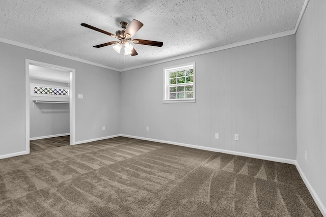 10650 Forest Creek Dr, Conroe, TX 77318 - spare room featuring a textured ceiling, carpet floors, ceiling fan, and crown molding
