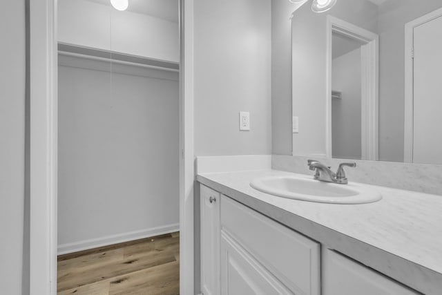 10650 Forest Creek Dr, Conroe, TX 77318 - bathroom featuring vanity and wood finished floors