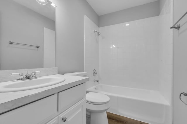 10650 Forest Creek Dr, Conroe, TX 77318 - bathroom featuring vanity, shower / bathtub combination, and wood finished floors