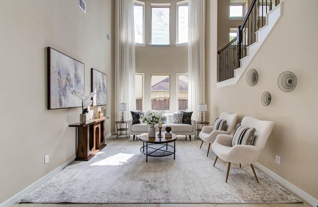 5719 Avon Landing Ln, Sugar Land, TX 77479 - living room with a high ceiling, plenty of natural light, and stairway