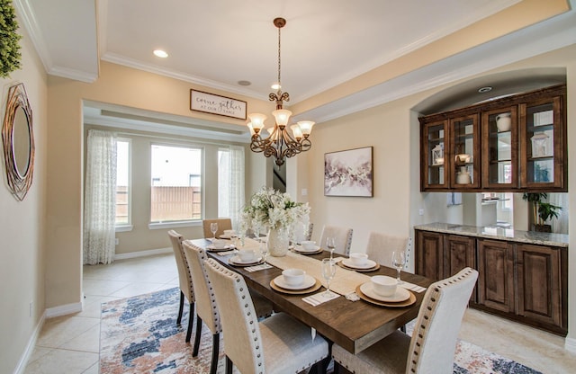 5719 Avon Landing Ln, Sugar Land, TX 77479 - dining space featuring ornamental molding, light tile patterned floors, a chandelier, and recessed lighting