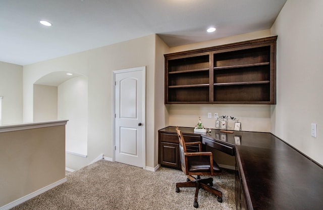 5719 Avon Landing Ln, Sugar Land, TX 77479 - home office featuring arched walkways, recessed lighting, and light carpet