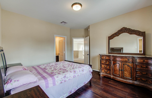 5719 Avon Landing Ln, Sugar Land, TX 77479 - bedroom with dark wood-style floors and baseboards