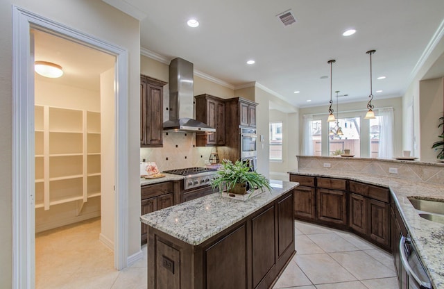 5719 Avon Landing Ln, Sugar Land, TX 77479 - kitchen with wall chimney exhaust hood, stainless steel appliances, backsplash, light tile patterned flooring, and dark brown cabinetry