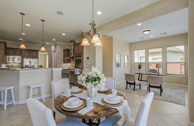 5719 Avon Landing Ln, Sugar Land, TX 77479 - dining area with light tile patterned floors, recessed lighting, and ornamental molding