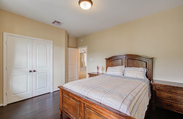 5719 Avon Landing Ln, Sugar Land, TX 77479 - bedroom with a closet and dark wood-style floors