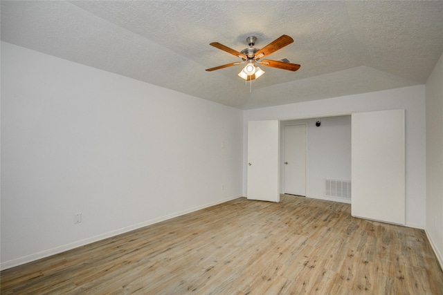 7502 Dawnbriar Ct, Houston, TX 77489 - empty room with hardwood / wood-style flooring, ceiling fan, a textured ceiling, and vaulted ceiling