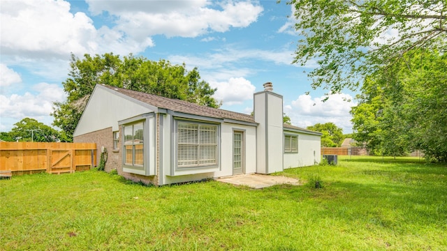 7502 Dawnbriar Ct, Houston, TX 77489 - rear view of house featuring a chimney