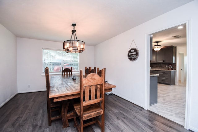 718 River Plantation Dr, Conroe, TX 77302 - dining space featuring a chandelier, wood finished floors, and ceiling fan