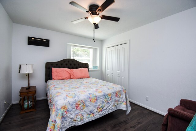 718 River Plantation Dr, Conroe, TX 77302 - bedroom with dark wood-type flooring, a closet, and a ceiling fan