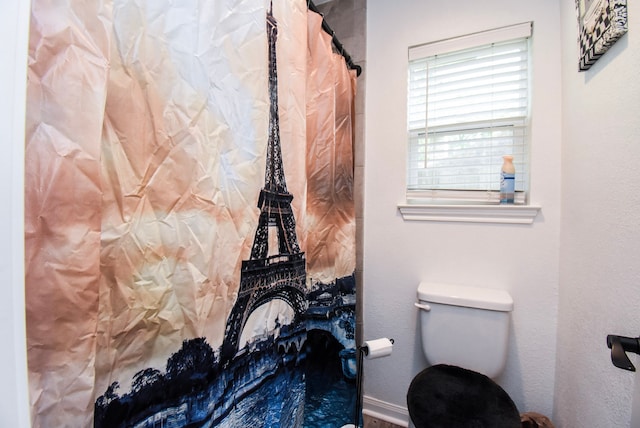 718 River Plantation Dr, Conroe, TX 77302 - bathroom with toilet and a shower with shower curtain