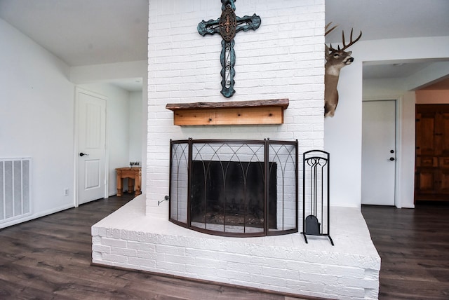 718 River Plantation Dr, Conroe, TX 77302 - detailed view of a brick fireplace and wood finished floors