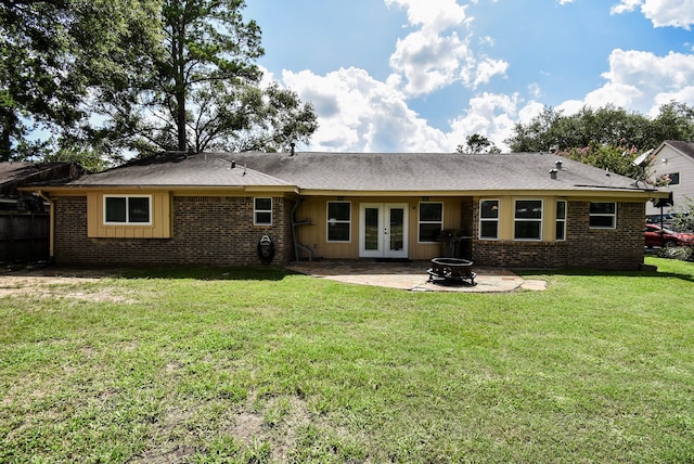 718 River Plantation Dr, Conroe, TX 77302 - rear view of house featuring french doors, a patio area, an outdoor fire pit, and brick siding