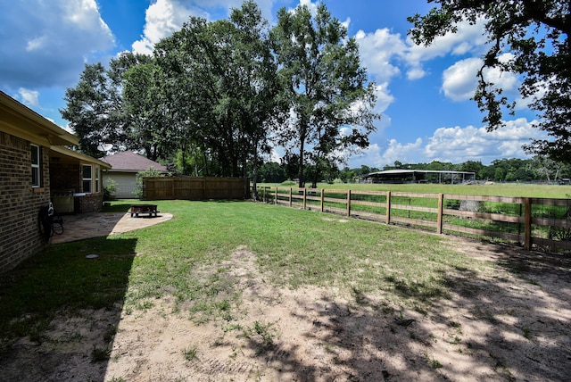 718 River Plantation Dr, Conroe, TX 77302 - view of yard with a patio area and a fire pit