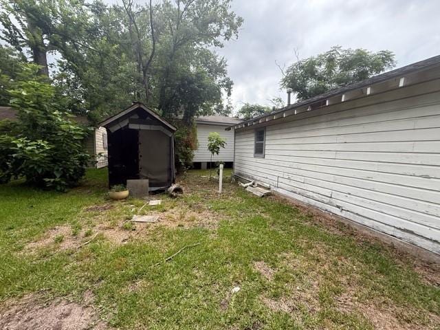 1053 Marjorie St, Houston, TX 77088 - view of green lawn featuring a storage unit