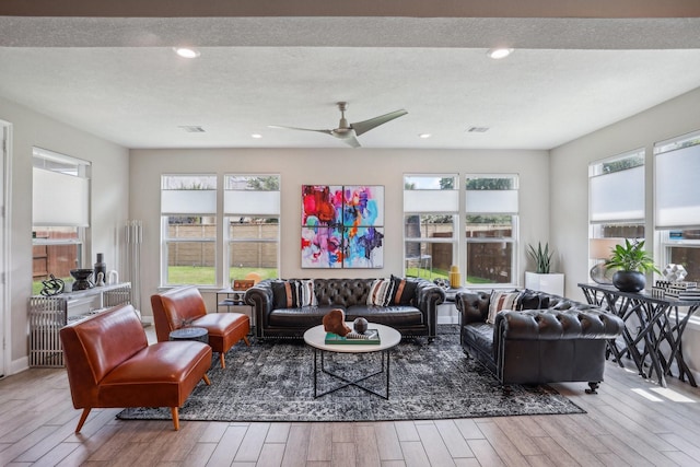 6019 Rivergrove Bend Dr, Humble, TX 77346 - living area with wood finished floors, ceiling fan, and recessed lighting
