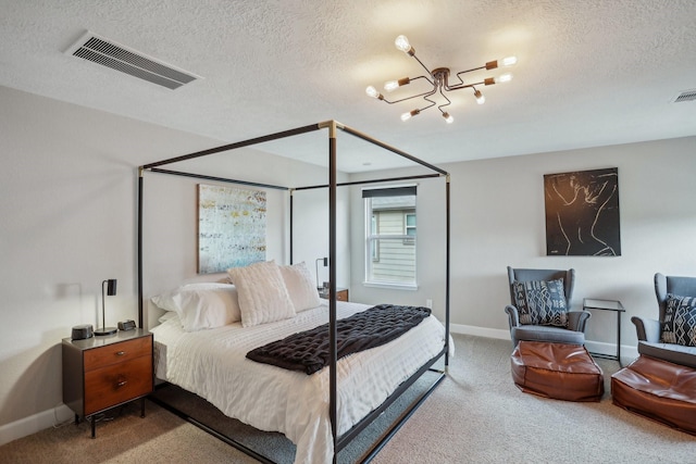 6019 Rivergrove Bend Dr, Humble, TX 77346 - bedroom with carpet, a textured ceiling, and a chandelier