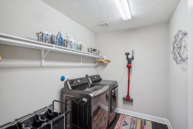 6019 Rivergrove Bend Dr, Humble, TX 77346 - washroom with separate washer and dryer and a textured ceiling