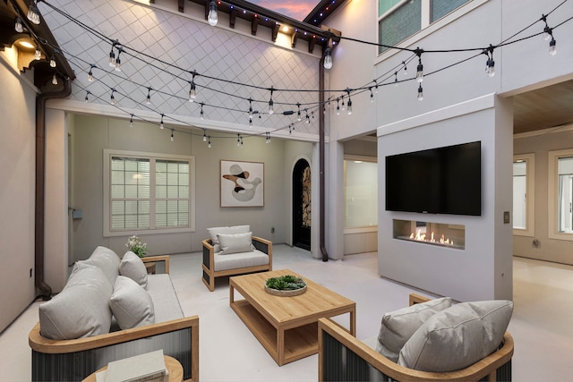 3971 Rolling Thicket Dr, Spring, TX 77386 - living area with a glass covered fireplace, arched walkways, and a high ceiling