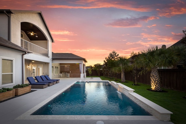 3971 Rolling Thicket Dr, Spring, TX 77386 - pool at dusk with a fenced backyard, a patio, and ceiling fan