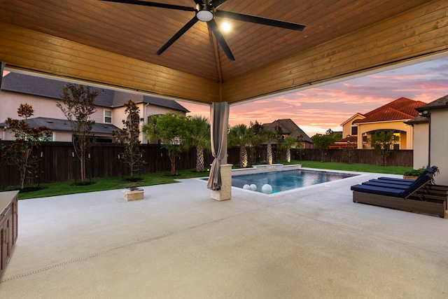 3971 Rolling Thicket Dr, Spring, TX 77386 - pool at dusk with a patio area, a fenced backyard, and ceiling fan