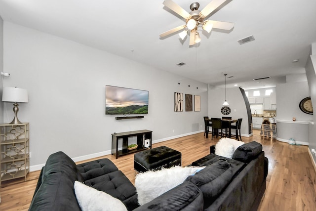 8710 Beverlyhill St Unit 201, Houston, TX 77063 - living area with ceiling fan and light wood-style floors