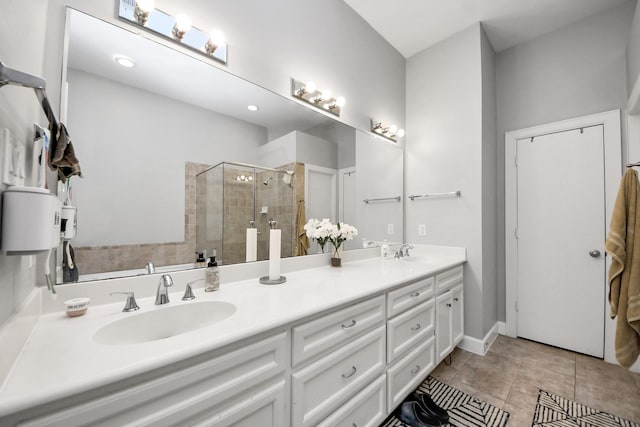 8710 Beverlyhill St Unit 201, Houston, TX 77063 - bathroom featuring double vanity, a shower stall, and tile patterned floors