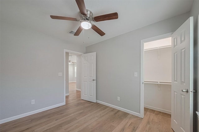 12210 Palmbeach St, Houston, TX 77034 - unfurnished bedroom with light wood-type flooring, a closet, and a ceiling fan