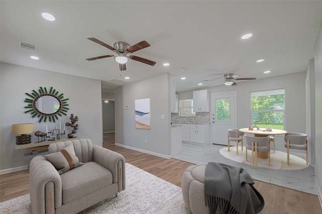 12210 Palmbeach St, Houston, TX 77034 - living area with ceiling fan, recessed lighting, and light wood-style floors
