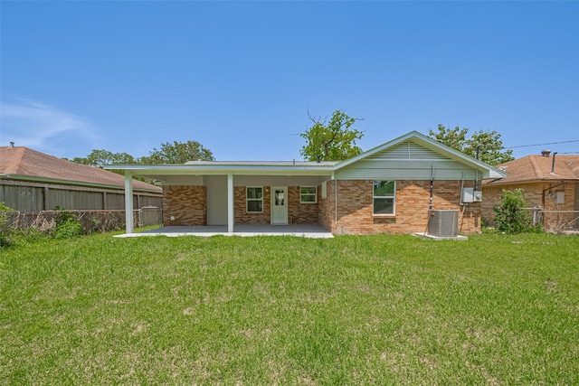12210 Palmbeach St, Houston, TX 77034 - back of property featuring a fenced backyard, a patio, and brick siding