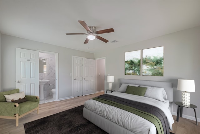 12210 Palmbeach St, Houston, TX 77034 - bedroom featuring light wood-type flooring, ensuite bathroom, and ceiling fan