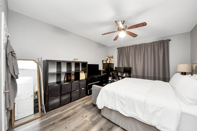 2100 Tanglewilde St Unit 312, Houston, TX 77063 - bedroom featuring wood finished floors and ceiling fan