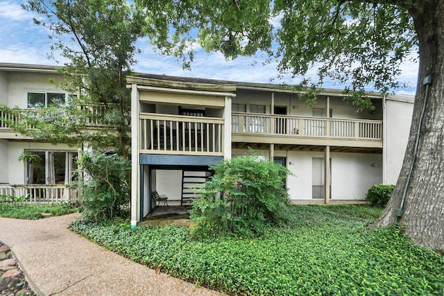 2100 Tanglewilde St Unit 312, Houston, TX 77063 - back of house with stucco siding