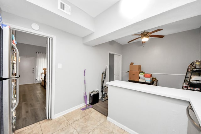 2100 Tanglewilde St Unit 312, Houston, TX 77063 - bar with a ceiling fan, stainless steel appliances, and light wood-style floors