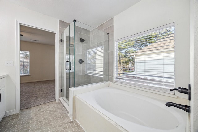 18035 Berry Branch Dr, Houston, TX 77084 - full bath with a bath, a stall shower, plenty of natural light, and vanity