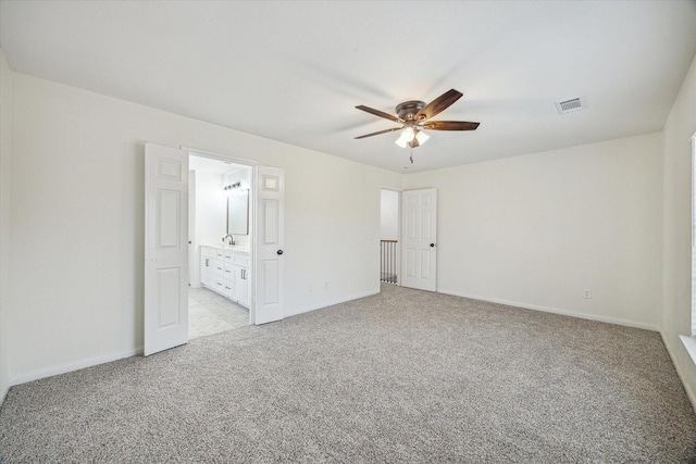 18035 Berry Branch Dr, Houston, TX 77084 - unfurnished bedroom featuring light carpet, ensuite bath, and ceiling fan