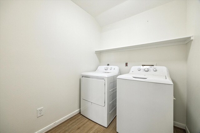 18035 Berry Branch Dr, Houston, TX 77084 - laundry room with washing machine and dryer and light wood-type flooring