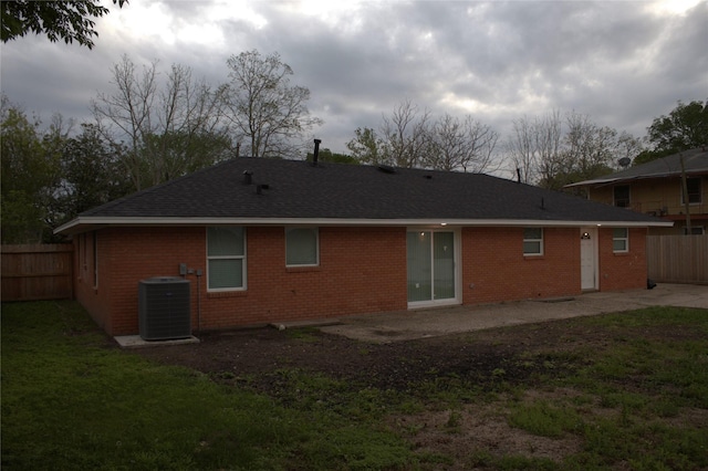 5105 Oak Ave, Pasadena, TX 77503 - rear view of house featuring a patio, brick siding, and a shingled roof