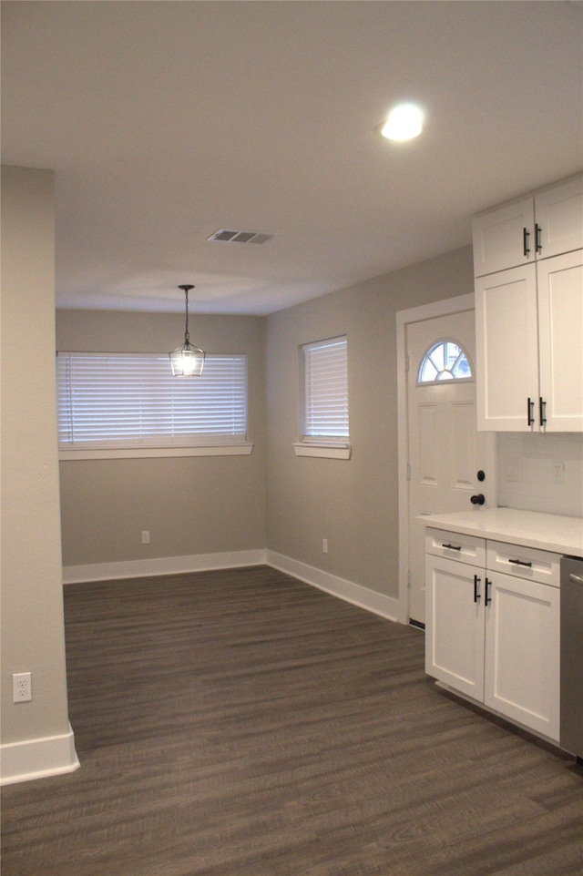 5105 Oak Ave, Pasadena, TX 77503 - kitchen featuring white cabinets, light countertops, dark wood-type flooring, decorative light fixtures, and dishwasher