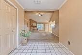 55 Sweetgum Ct, Lake Jackson, TX 77566 - hall with crown molding and vaulted ceiling