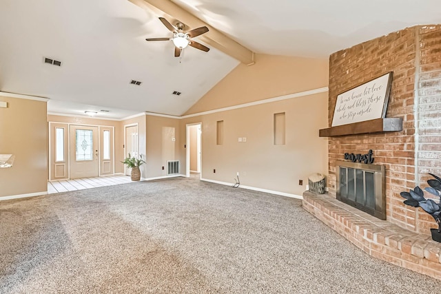 55 Sweetgum Ct, Lake Jackson, TX 77566 - unfurnished living room with ceiling fan, beamed ceiling, a brick fireplace, carpet floors, and high vaulted ceiling