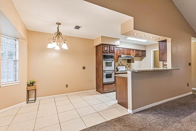 55 Sweetgum Ct, Lake Jackson, TX 77566 - kitchen featuring under cabinet range hood, stainless steel double oven, a chandelier, pendant lighting, and a peninsula