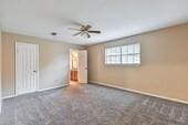 55 Sweetgum Ct, Lake Jackson, TX 77566 - unfurnished bedroom featuring carpet floors