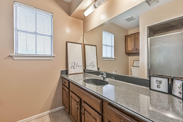 55 Sweetgum Ct, Lake Jackson, TX 77566 - full bath featuring tile patterned floors, vanity, and a shower with shower door