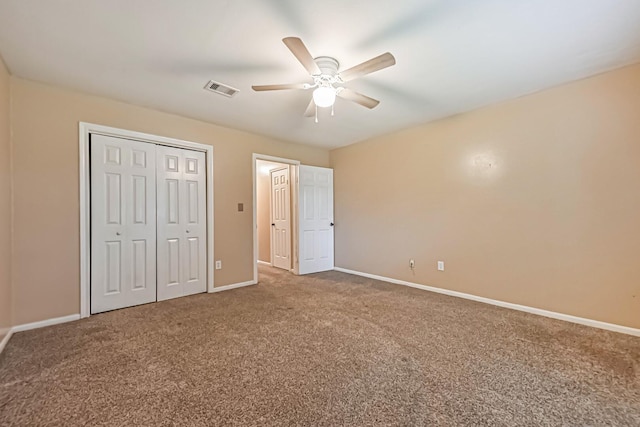 55 Sweetgum Ct, Lake Jackson, TX 77566 - unfurnished bedroom featuring carpet, a closet, and a ceiling fan