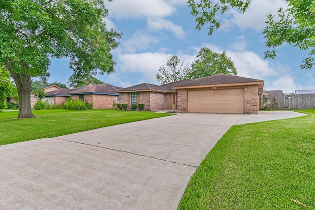 55 Sweetgum Ct, Lake Jackson, TX 77566 - ranch-style house with concrete driveway, an attached garage, and brick siding