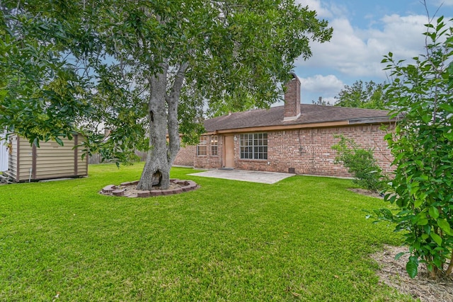 55 Sweetgum Ct, Lake Jackson, TX 77566 - view of green lawn featuring a patio and a shed