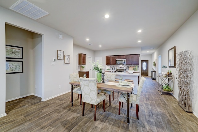14242 W Pine Heart Dr, Conroe, TX 77302 - dining room featuring dark wood-style floors and recessed lighting